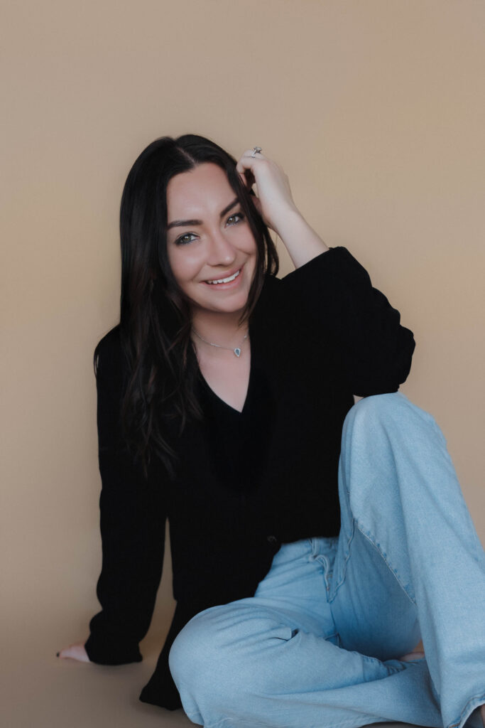 female photographer poses for a headshot