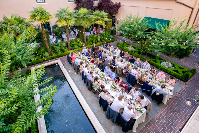 Historic wedding ceremony and reception at Planters Inn Charleston SC captured by professional wedding photographer