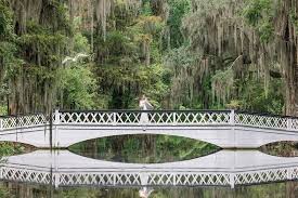 Couple exchanging vows in Magnolia Plantation gardens Charleston SC with beautiful Lowcountry wedding photography
