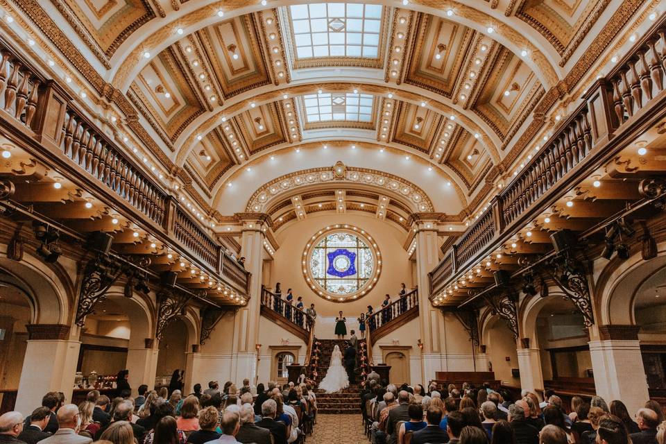 A bride and groom pose for their wedding day photos at The Historic Sunset Station in San Antonio, Texas
